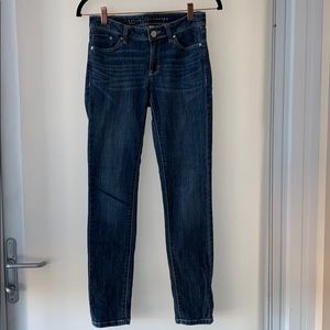 Blue jeans with slight fading near pockets